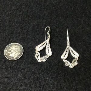 Silver lace like dangling earrings